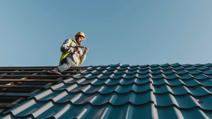 man on top of roof
