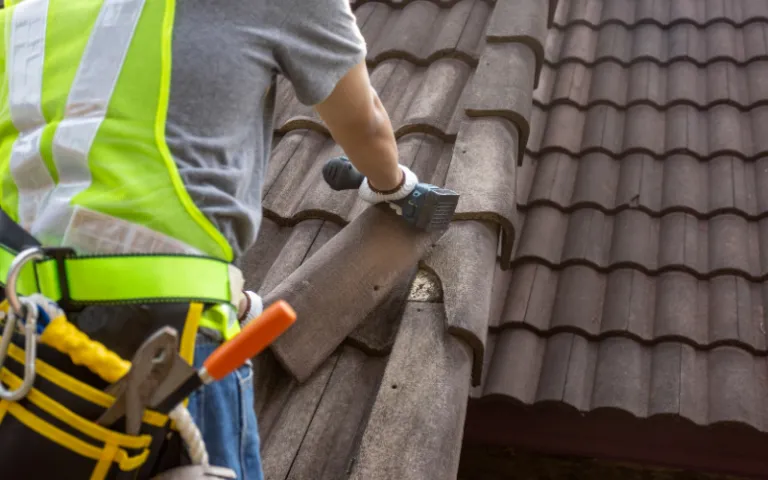 man repairing roof