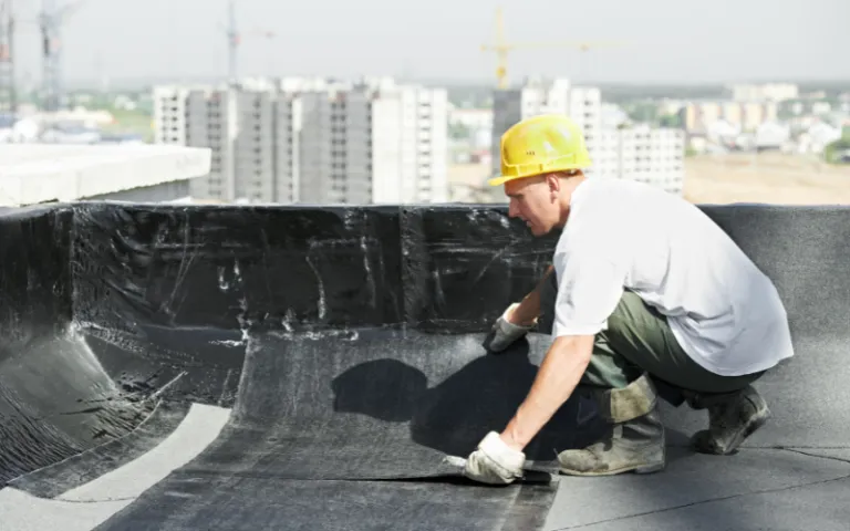 man working on flat roof