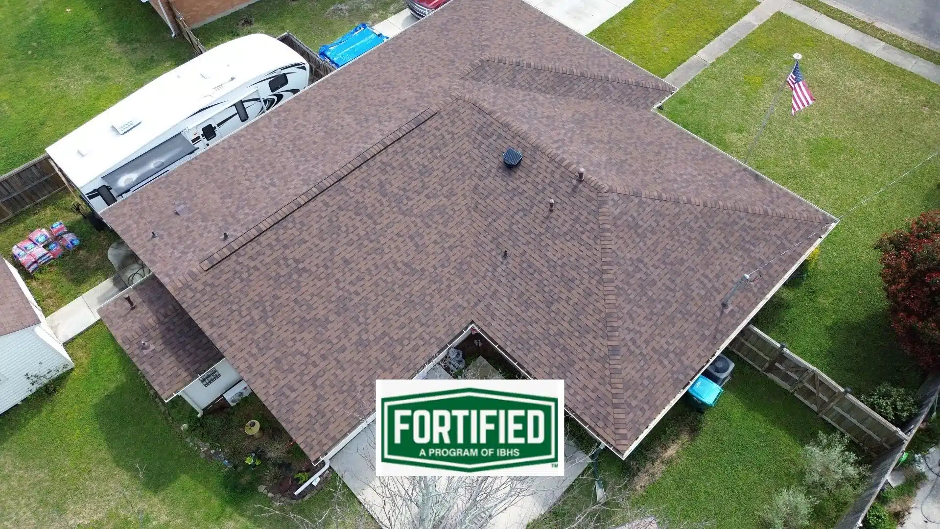 Aerial view of a FORTIFIED roof on a home in Gulfport, MS, featuring high-quality shingles that provide superior wind resistance and protection against severe weather, as part of the FORTIFIED roofing program. This description and alt text should align with the blog content, focusing on the benefits of FORTIFIED roofs and their application in areas like Gulfport, MS.