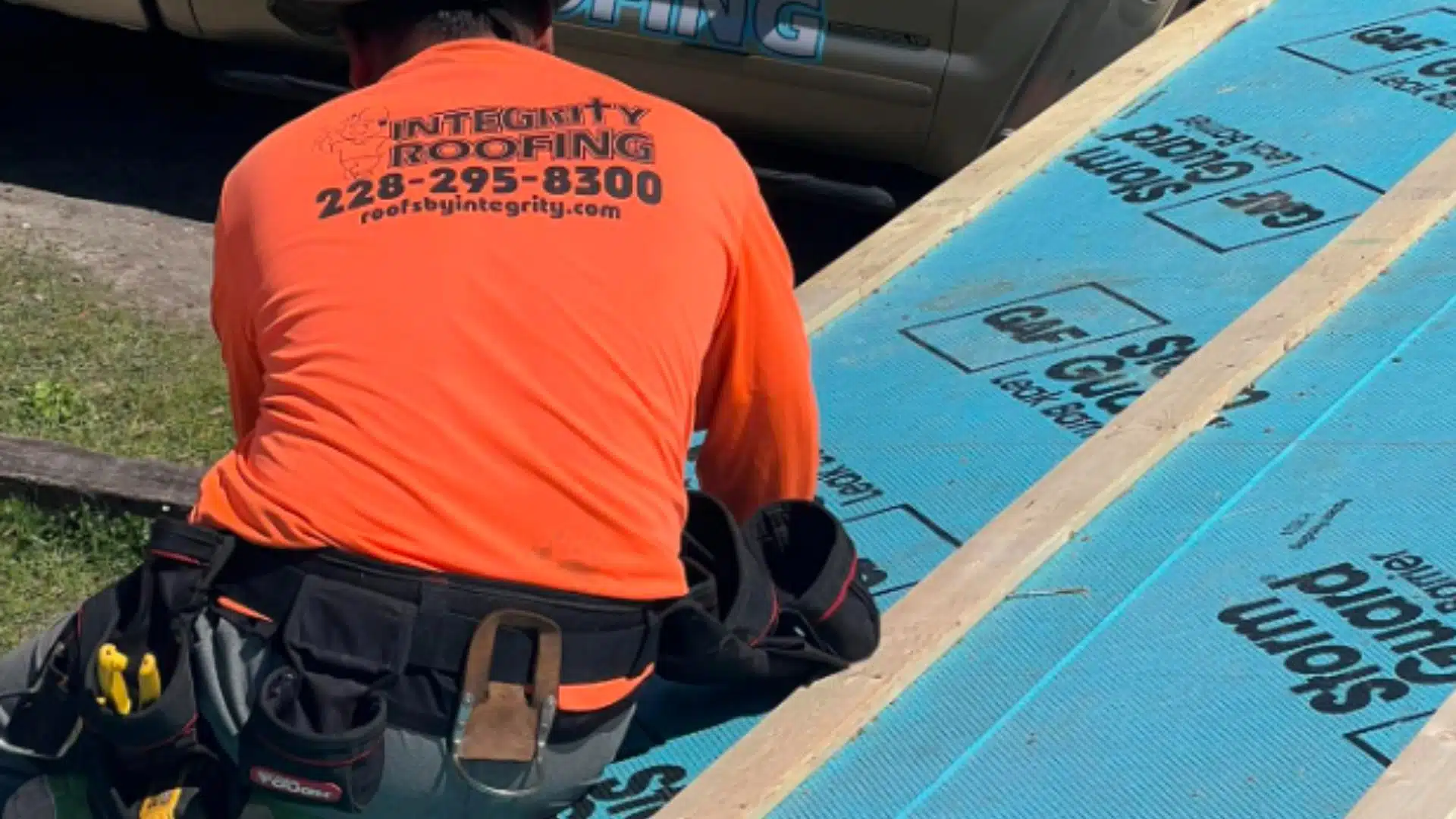 Integrity Roofing contractor installing StormGuard waterproof underlayment in Gulfport MS for hurricane roof preparation on the Mississippi Gulf Coast