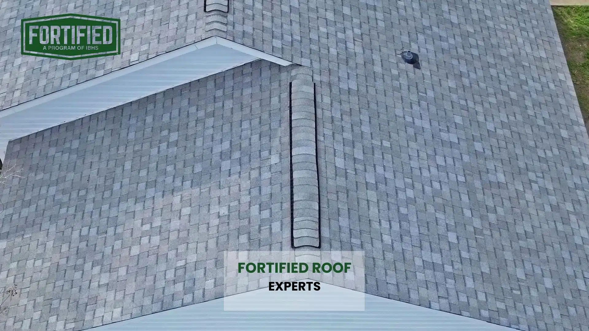 Top-down view of a FORTIFIED Roof with impact-resistant shingles and clean ridge lines, showcasing expert installation and maintenance in Gulfport MS.