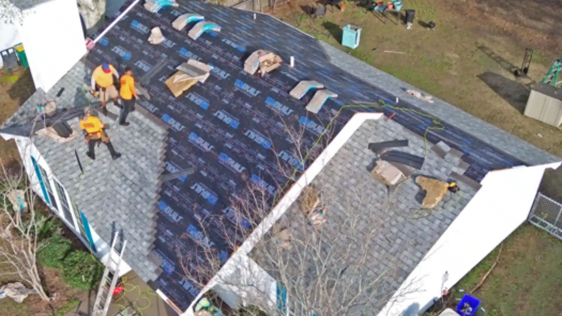 Licensed roofer in Gulfport, MS installing a hurricane-ready roof—tear-off, sealed deck, underlayment, and new flashing—with tarps and magnet clean-up for property protection.
