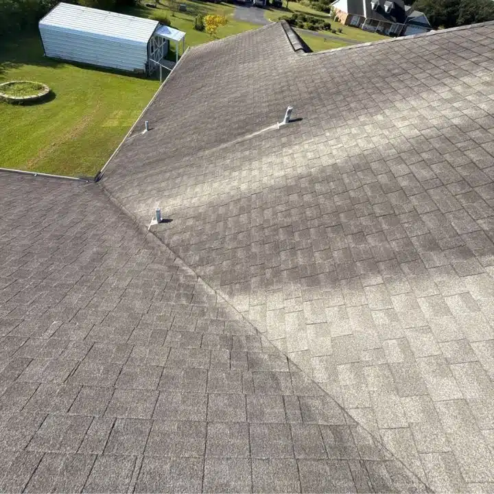 Asphalt shingle roof view during professional roof inspection by Integrity Roofing in Biloxi MS showing vent pipes, valleys, and overall roof condition.