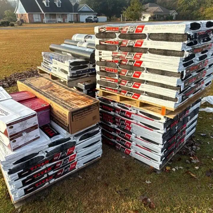 Roofing materials delivery stacked on pallets at a residential job site for a roof replacement project by Integrity Roofing in Biloxi MS.