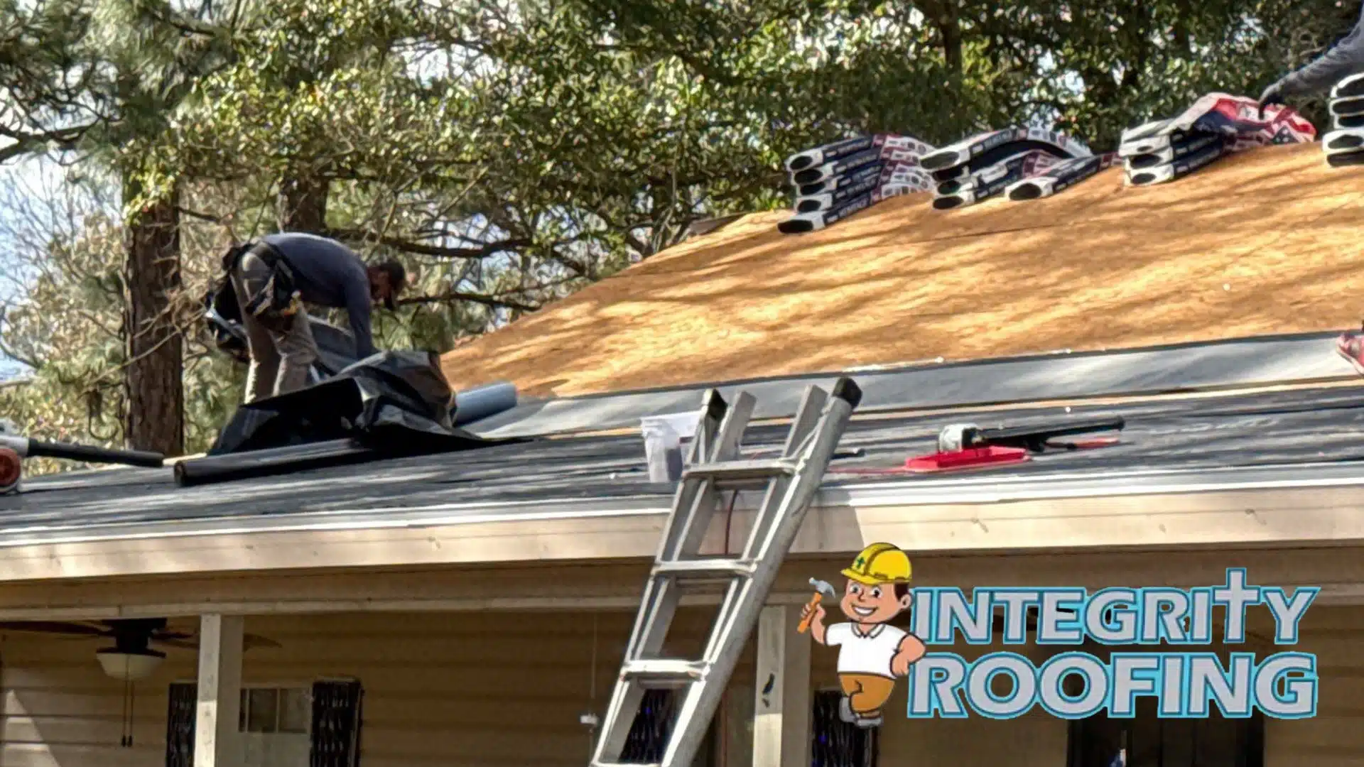 Professional roof inspection in Gulfport MS evaluating shingle alignment, flashing, and fortified roofing installation standards on a coastal home.