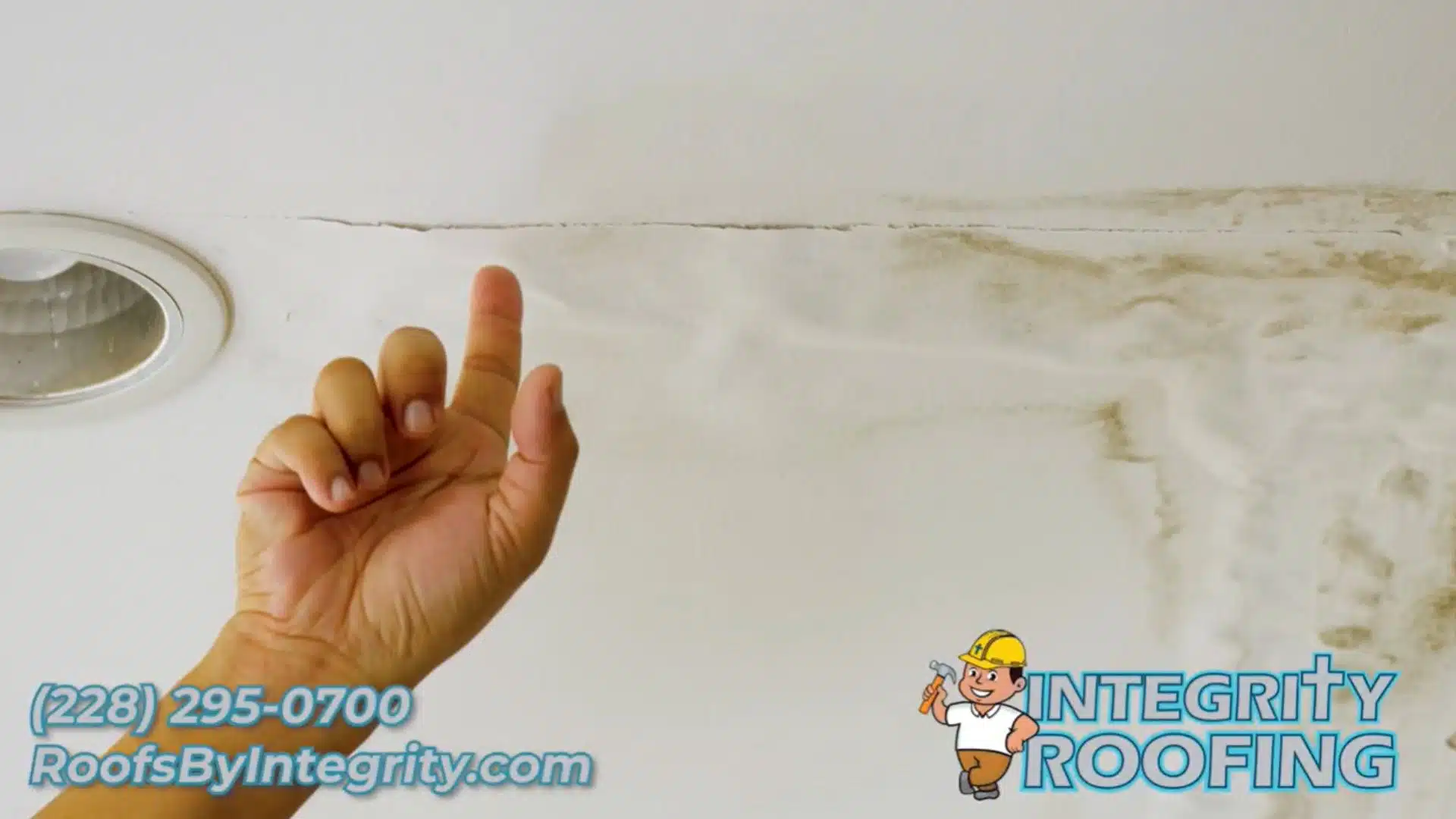 Water-stained ceiling in Ocean Springs MS home showing active roof leak damage after storm.