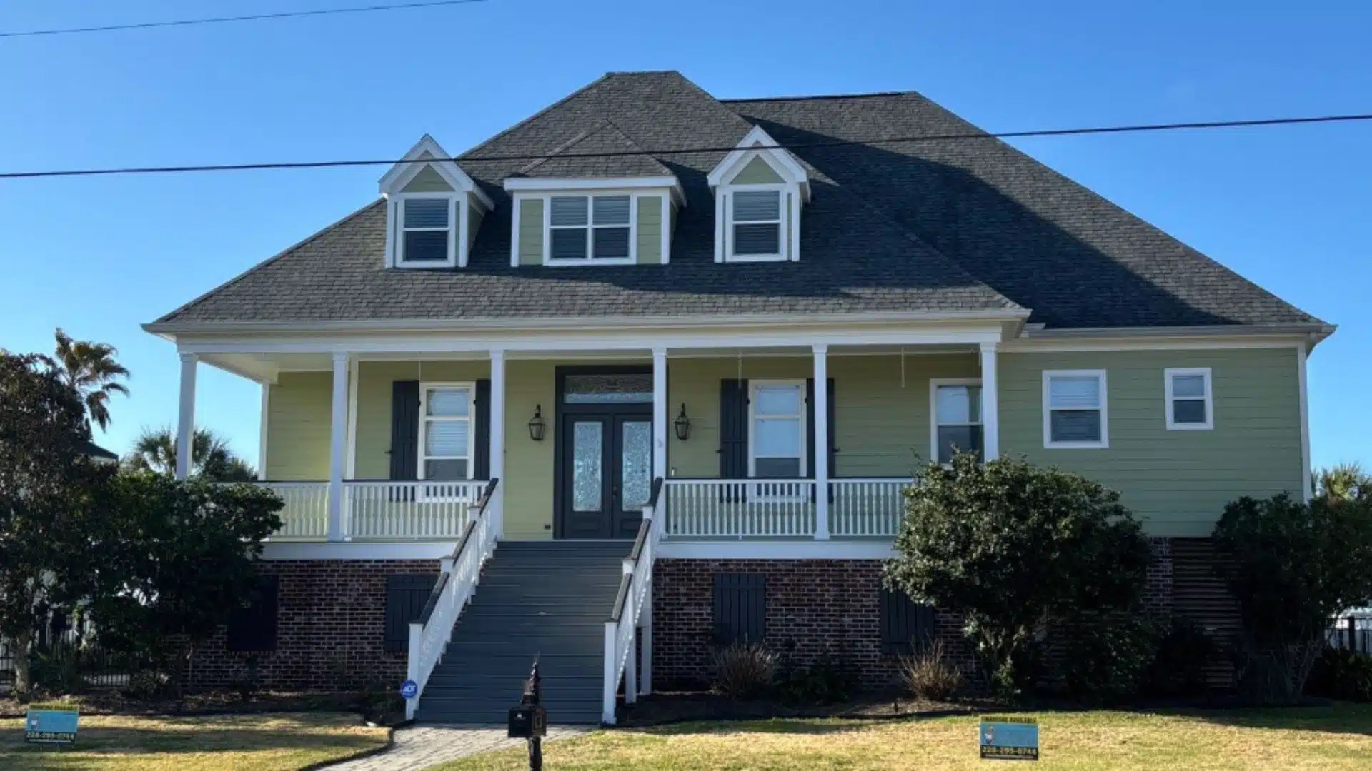 Newly installed roof on a residential home in Gulfport MS under a Gulf Coast sky showing professional roof replacement.