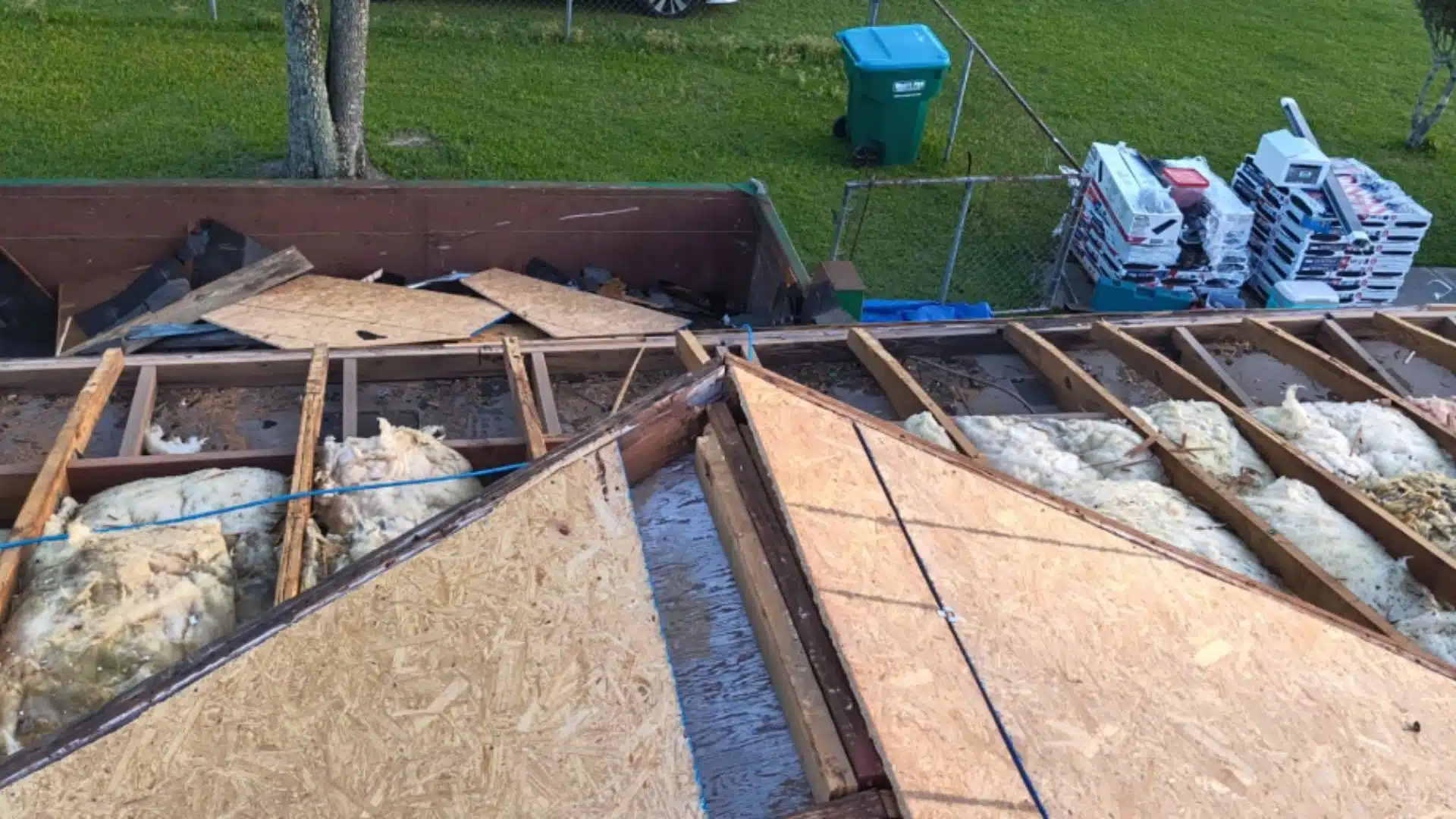 Roof decking and insulation exposed during a Gulfport MS roof leak repair inspection by Integrity Roofing.