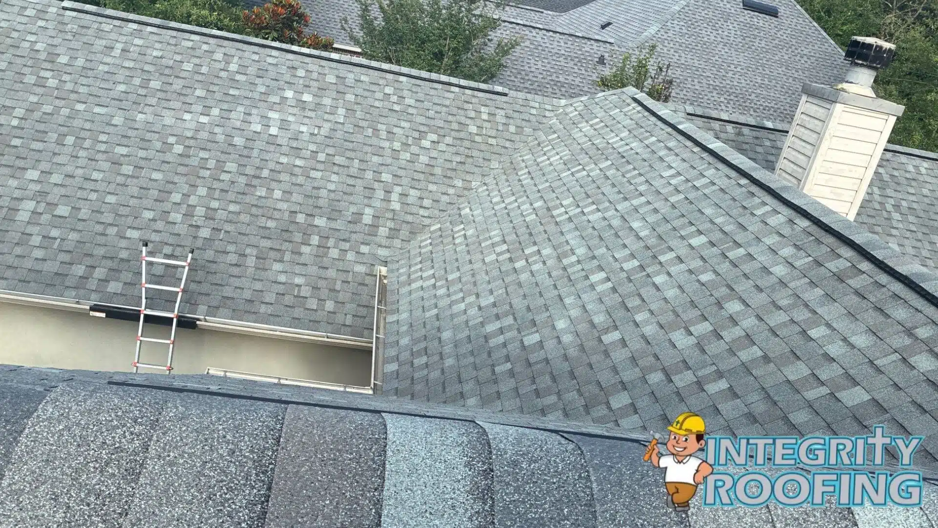 Close up comparison of a durable architectural laminate shingle versus a standard 3 tab asphalt shingle roof installation in Pass Christian Mississippi.