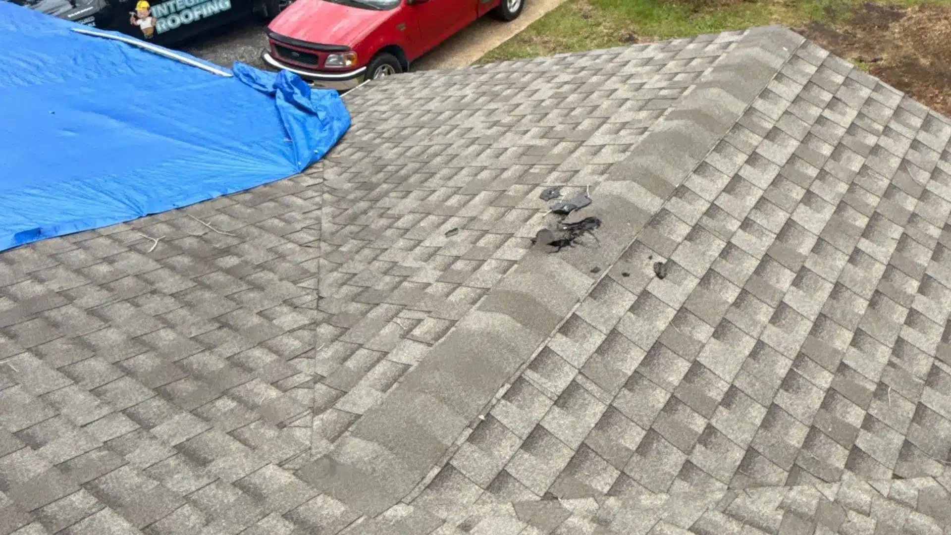 inspecting wind-damaged roof after Tropical Storm Arthur on the Mississippi Gulf Coast to assess insurance claim and named storm deductible.